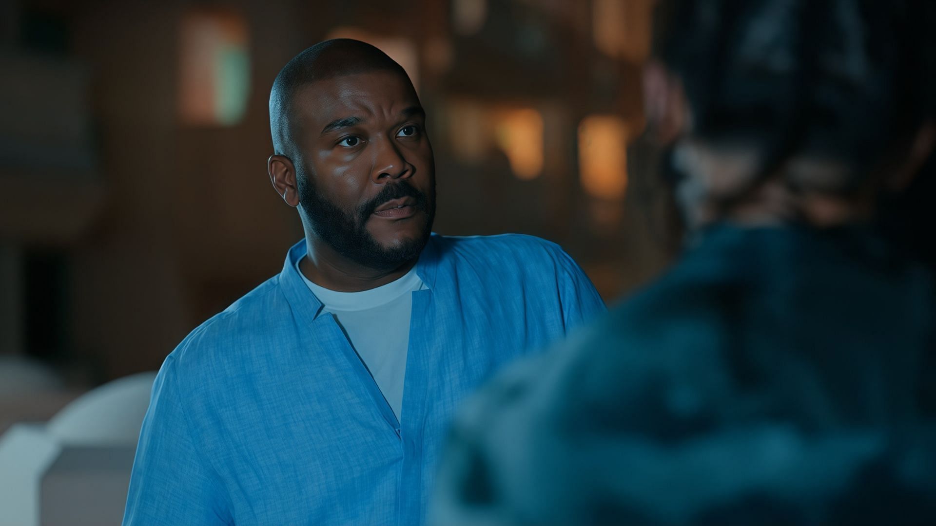 Brian gets to know about Zavier's background (Image via Madea’s Destination Wedding/Netflix)